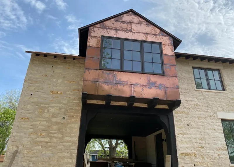 Copper metal panel facade on a stone building for Metal Roof Coating in Lathrop